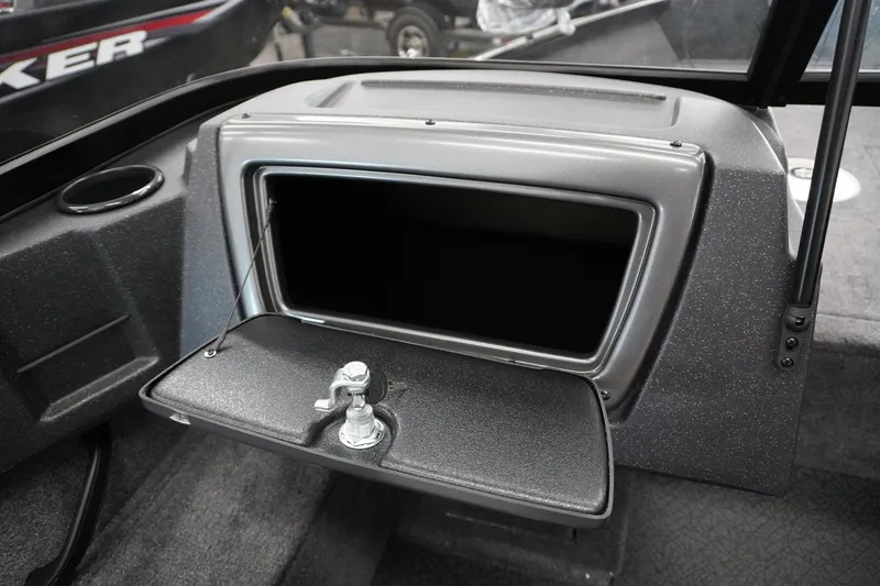 Slide: The Image of 2027 Tracker Pro Guide V-16 WT boat dashboard with open glove compartment. - 12