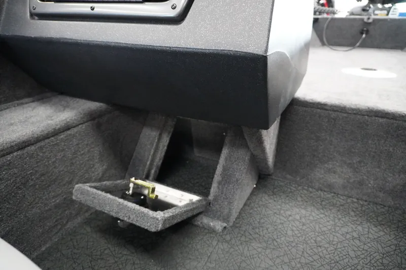 Slide: The Image of 2027 Tracker Pro Guide V-16 WT boat interior with storage compartment detail. - 13