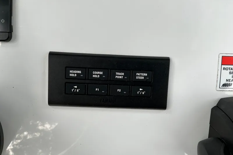 Slide: The Image of Control panel of a 2021 Sea Hunt Ultra 255SE boat with navigation buttons. - 3