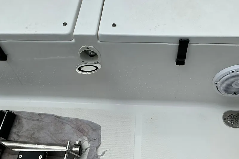Slide: The Image of 2021 Sea Hunt Ultra 255SE boat deck with speaker and storage compartments. - 21