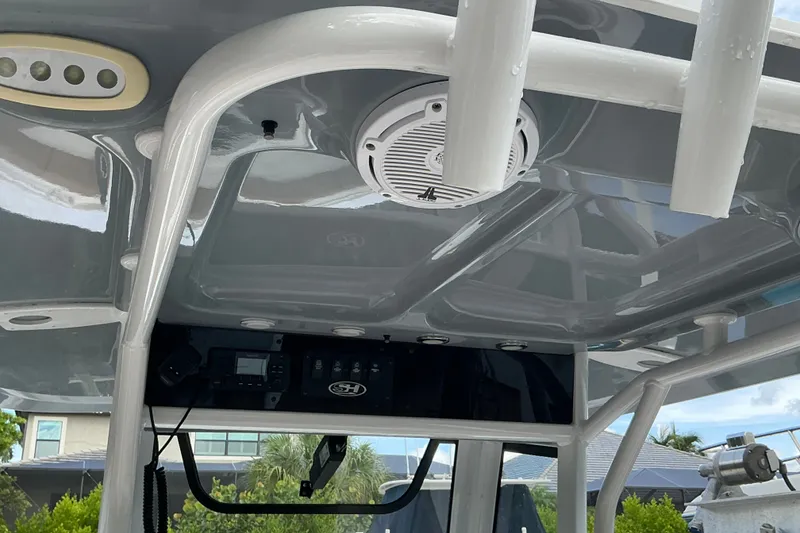Slide: The Image of Interior view of 2021 Sea Hunt Ultra 255SE boat's helm with speaker and controls. - 20