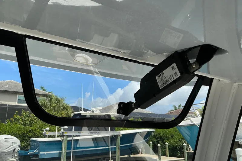 Slide: The Image of 2021 Sea Hunt Ultra 255SE boat window mechanism with outdoor view. - 34