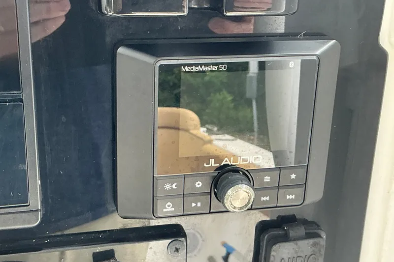 Slide: The Image of JL Audio MediaMaster 50 on 2021 Sea Hunt Ultra 255SE boat dashboard. - 28