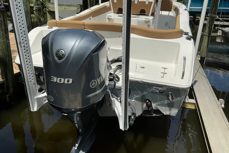 Slide: The Image of 2021 Sea Hunt Ultra 255SE boat with Yamaha 300 engine docked in marina. - 35
