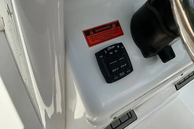 Slide: The Image of Control panel of a 2021 Sea Hunt Ultra 255SE boat with warning label. - 33