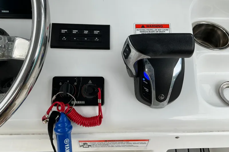 Slide: The Image of Control panel of a 2021 Sea Hunt Ultra 255SE boat with Yamaha throttle and steering wheel. - 5