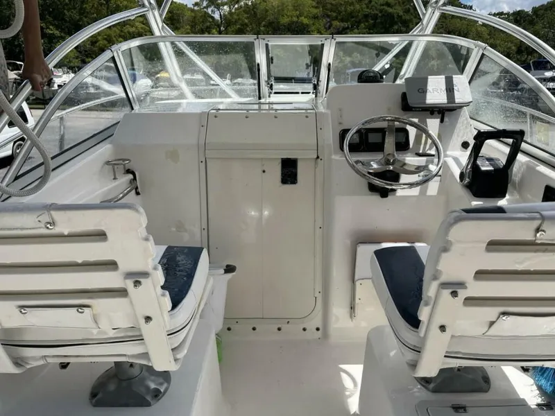 Slide: The Image of Helm of a 2006 Century 2400 Walk-Around with two seats and a Garmin navigation system. - 3