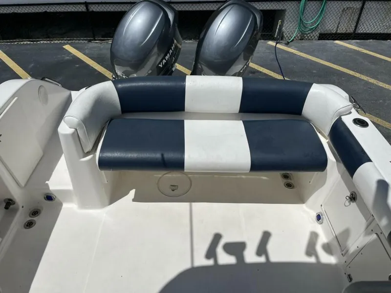 Slide: The Image of The image shows the cockpit of a 2006 Century 2400 Walk-Around with a cushioned bench seat. - 8