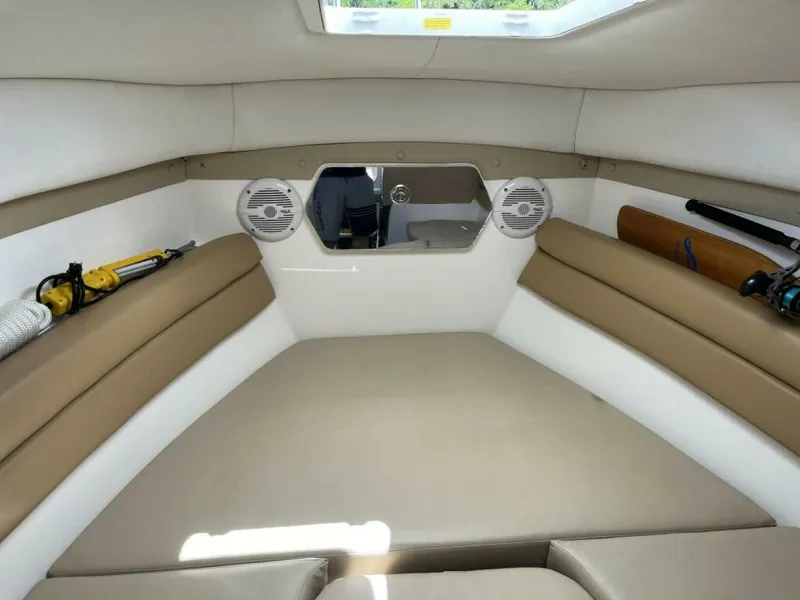 Slide: The Image of Interior of a 2006 Century 2400 Walk-Around with beige cushions and speakers. - 12