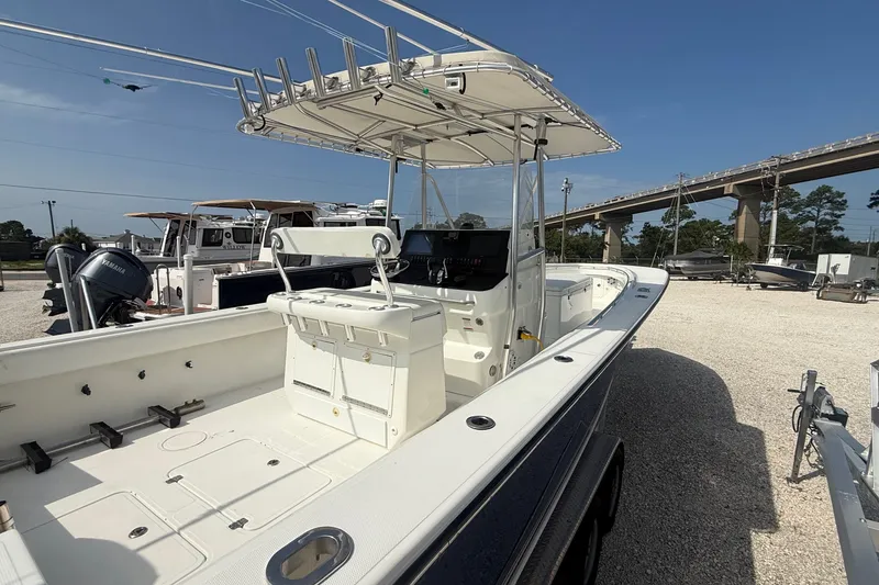 Slide: The Image of 2007 SeaCraft SC 32 Master Angler boat with center console and T-top in a marina. - 6