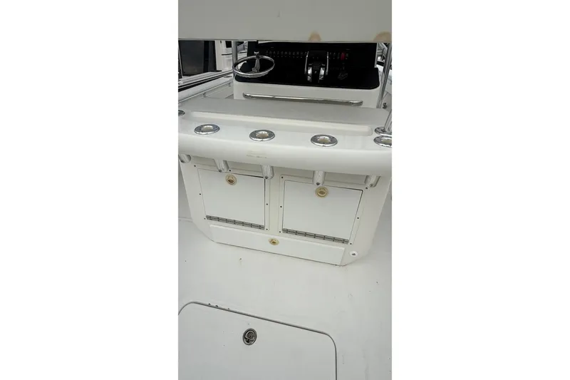 Slide: The Image of 2007 SeaCraft SC 32 Master Angler boat interior with steering console and storage compartments. - 37