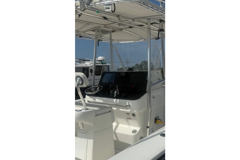 Slide: The Image of 2007 SeaCraft SC 32 Master Angler boat console with steering wheel and navigation equipment. - 7