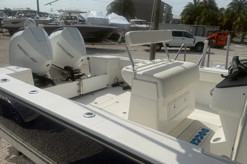 Slide: The Image of 2007 SeaCraft SC 32 Master Angler boat with dual Mercury engines, docked in a marina. - 10