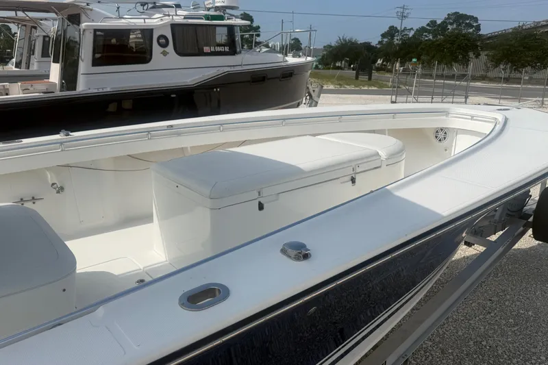 Slide: The Image of 2007 SeaCraft SC 32 Master Angler boat with spacious deck and seating, docked outdoors. - 9