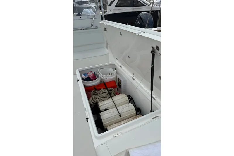 Slide: The Image of Storage compartment of 2007 SeaCraft SC 32 Master Angler with fishing gear and supplies. - 26