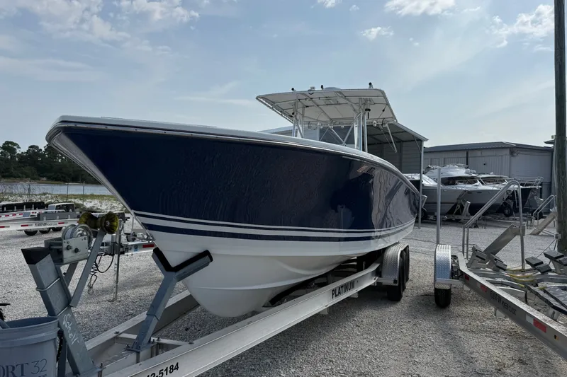 Slide: The Image of 2007 SeaCraft SC 32 Master Angler boat on trailer, parked outdoors under cloudy sky. - 3