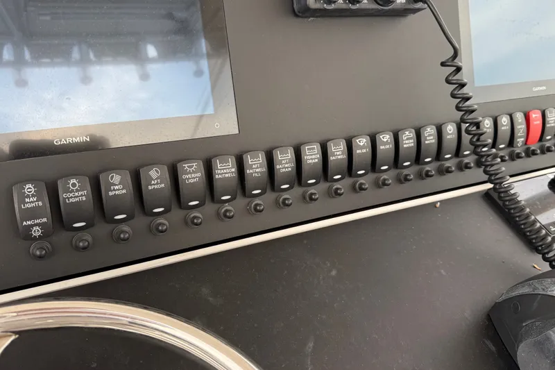 Slide: The Image of Control panel of a 2007 SeaCraft SC 32 Master Angler boat with Garmin displays. - 15