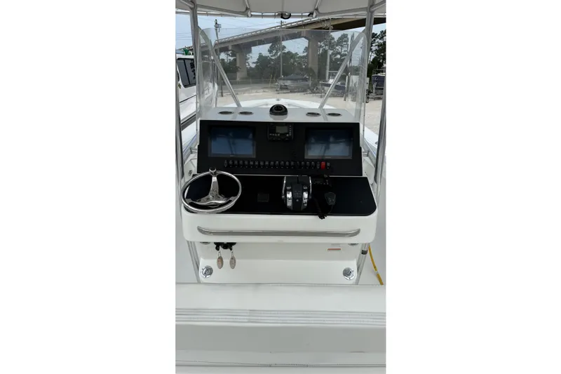 Slide: The Image of 2007 SeaCraft SC 32 Master Angler boat console with steering wheel and controls. - 12