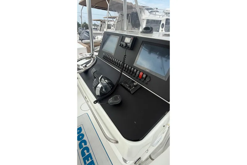 Slide: The Image of 2007 SeaCraft SC 32 Master Angler boat console with navigation equipment and controls. - 28