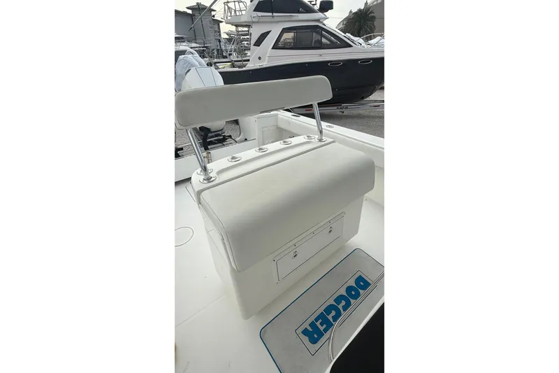 Slide: The Image of 2007 SeaCraft SC 32 Master Angler boat with white seating and storage compartment. - 27
