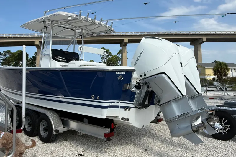 The Image of 2007 SeaCraft SC 32 Master Angler boat with dual Mercury engines on a trailer. - 0