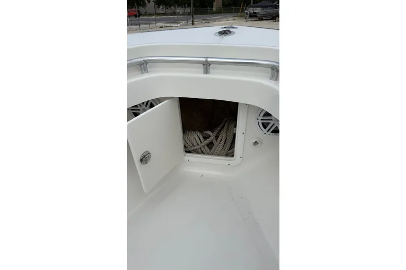 Slide: The Image of 2007 SeaCraft SC 32 Master Angler boat storage compartment with rope and speaker. - 21