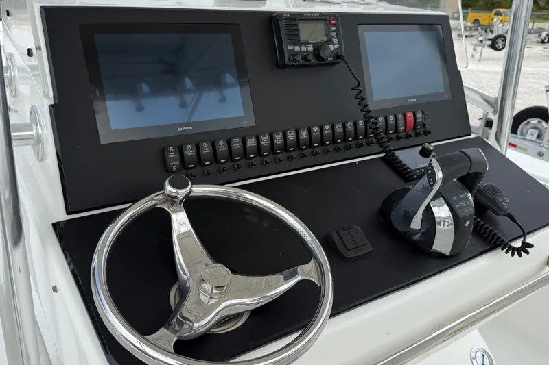 Slide: The Image of 2007 SeaCraft SC 32 Master Angler dashboard with steering wheel and navigation controls. - 14