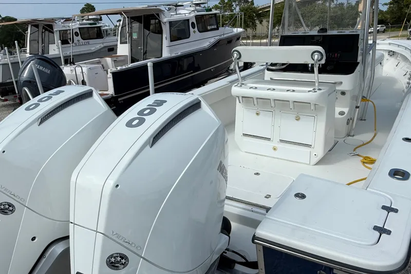 Slide: The Image of 2007 SeaCraft SC 32 Master Angler boat with dual 300 horsepower engines docked. - 11