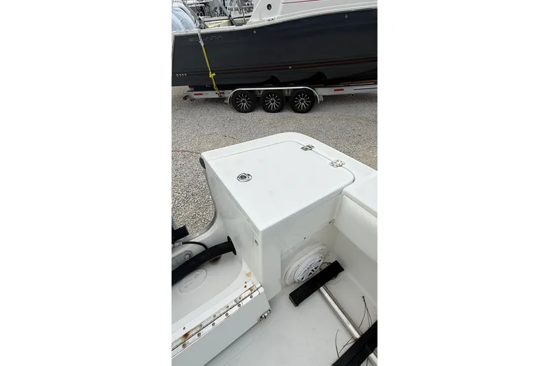 Slide: The Image of 2007 SeaCraft SC 32 Master Angler boat interior with storage compartment and visible trailer. - 35