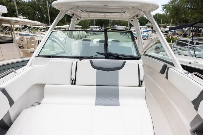 Slide: The Image of 2023 Chaparral 300 OSX with spacious, modern cockpit and luxurious seating. - 13