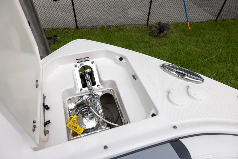 Slide: The Image of Anchor locker of the 2023 Chaparral 300 OSX with stainless steel anchor and chain. - 12