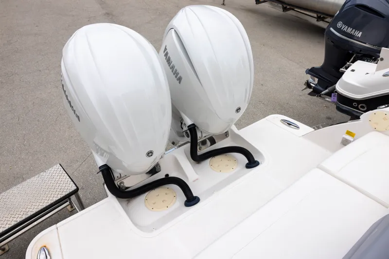 Slide: The Image of Two Yamaha outboard engines are mounted on the stern of a Chaparral 300 OSX boat. - 6