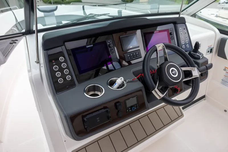 Slide: The Image of The 2023 Chaparral 300 OSX cockpit features a modern dashboard with multiple screens. - 9