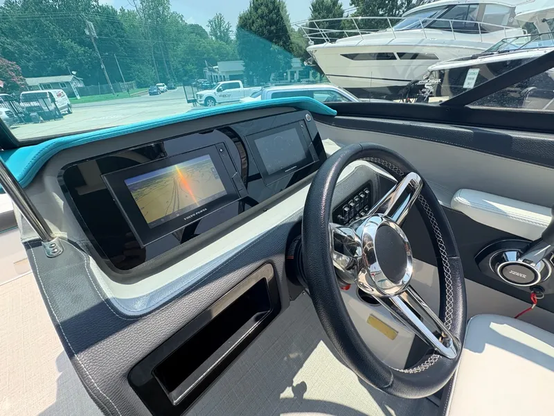 Slide: The Image of The image shows the cockpit of a 2020 Regal LS4 Surf with modern instruments and a sleek steering wheel. - 15