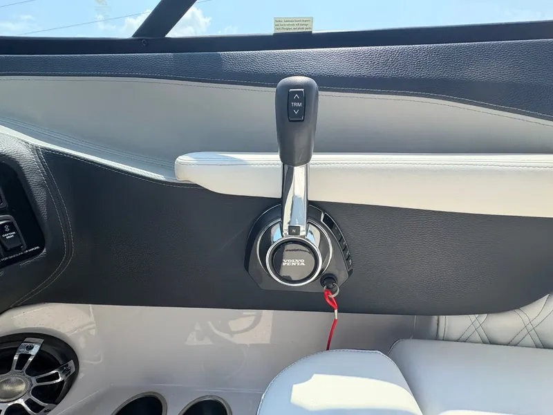 Slide: The Image of Close-up of the throttle lever in a 2020 Regal LS4 Surf boat with modern design. - 17