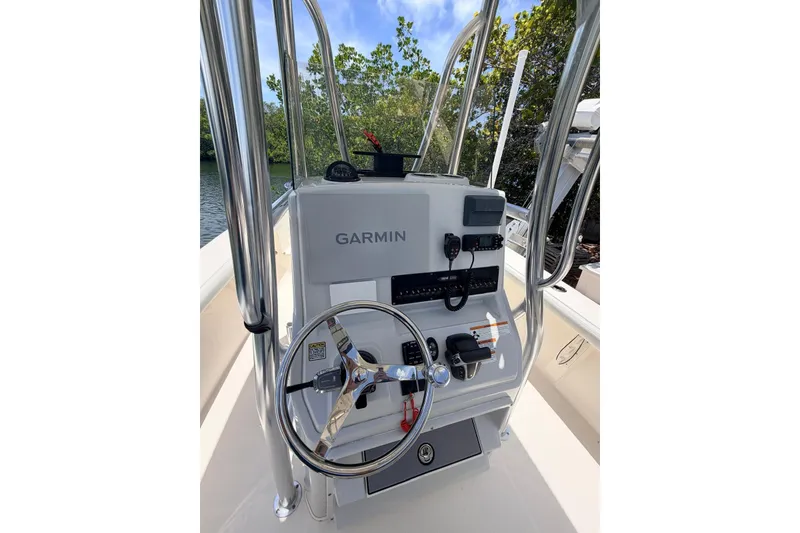 Slide: The Image of 2023 Pathfinder 2400 Open boat console with Garmin navigation system and steering wheel. - 9
