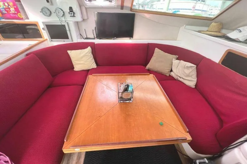 Slide: The Image of Interior of a yacht with red sofa and wooden table. - 33
