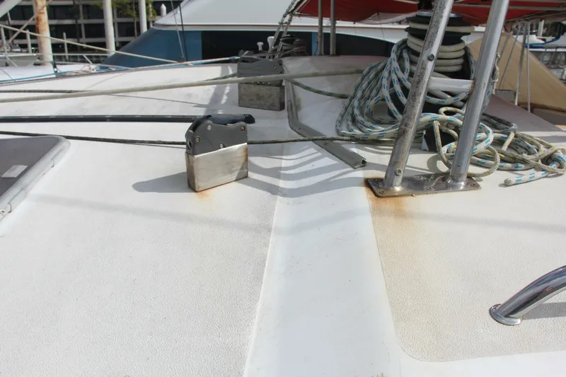 Slide: The Image of Deck of a 1995 Voyage Yachts Mayotte with ropes and metal fittings. - 49