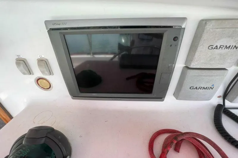 Slide: The Image of Garmin GPS and compass on a boat. - 41