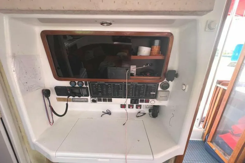 Slide: The Image of The image shows a yacht's navigation and communication panel with various instruments and switches. - 30