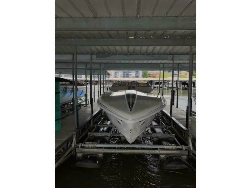Slide: The Image of 2002 Profile 33 V in a covered boat slip. - 10