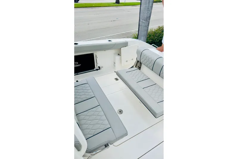 Slide: The Image of 2026 Pursuit S 288 Sport boat interior with cushioned seating and sleek design. - 12