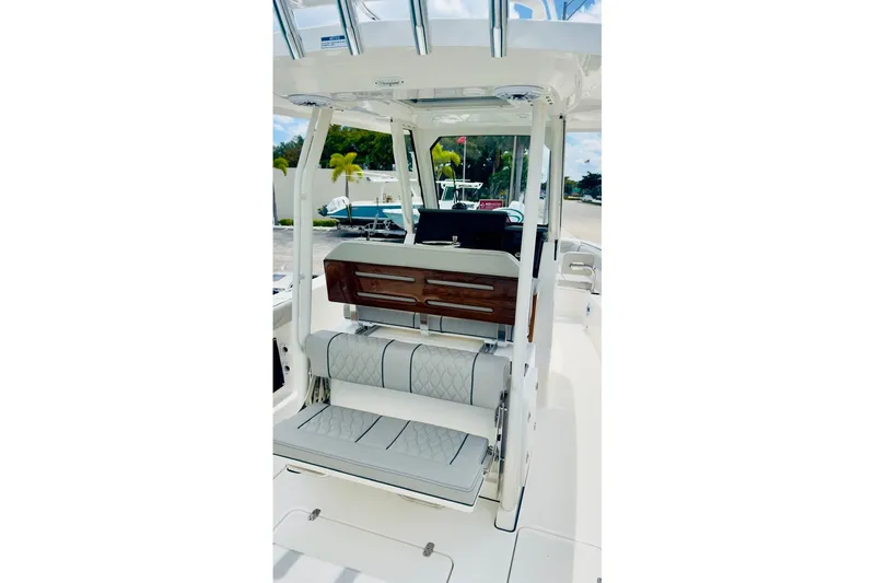 Slide: The Image of 2026 Pursuit S 288 Sport boat interior with cushioned seating and sleek design. - 3