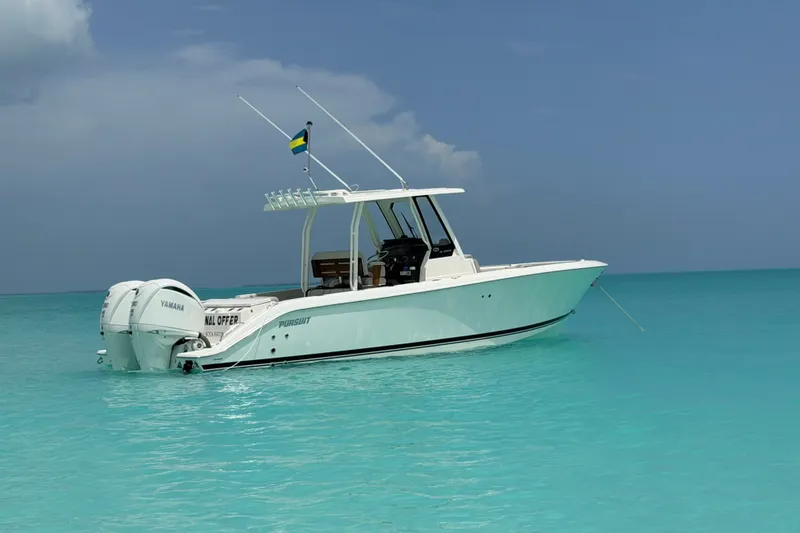 The Image of 2026 Pursuit S 288 Sport boat floating on clear turquoise water. - 0