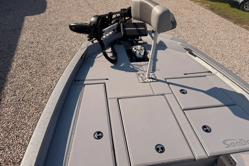 Slide: The Image of 2023 Xpress Boats H18 Bass deck with seating and fishing equipment. - 5