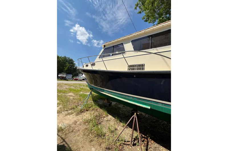 Slide: The Image of 2018 Eastern 35 Casco Bay boat on stands under a clear blue sky. - 38