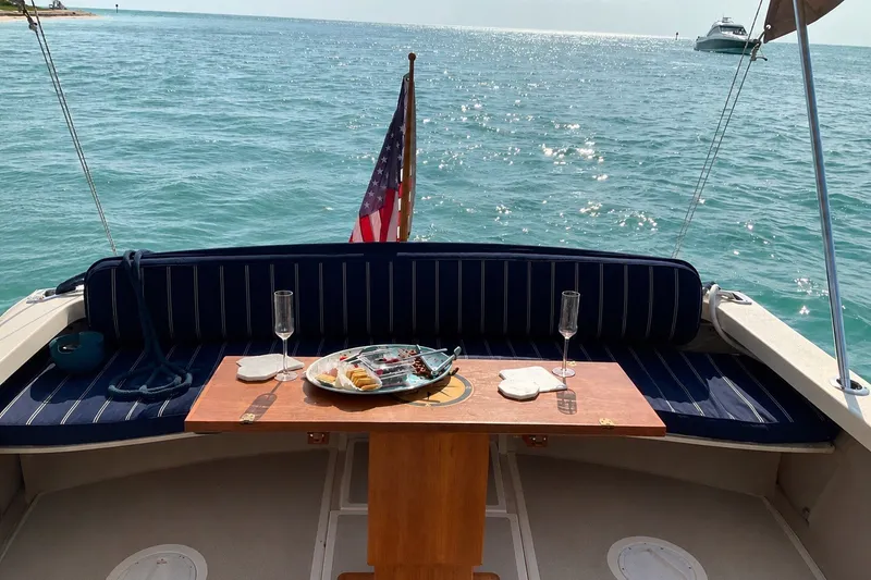 Slide: The Image of Cozy seating on 2018 Eastern 35 Casco Bay boat with ocean view and refreshments. - 8