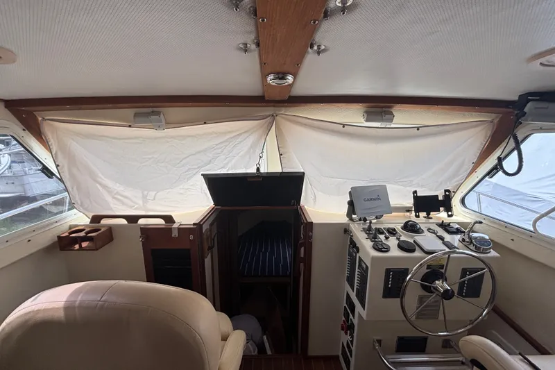 Slide: The Image of Interior of a 2018 Eastern 35 Casco Bay boat with helm and navigation equipment. - 13