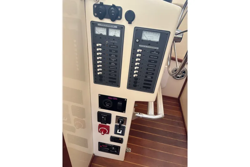 Slide: The Image of Electrical control panel on a 2018 Eastern 35 Casco Bay boat, featuring switches and gauges. - 31