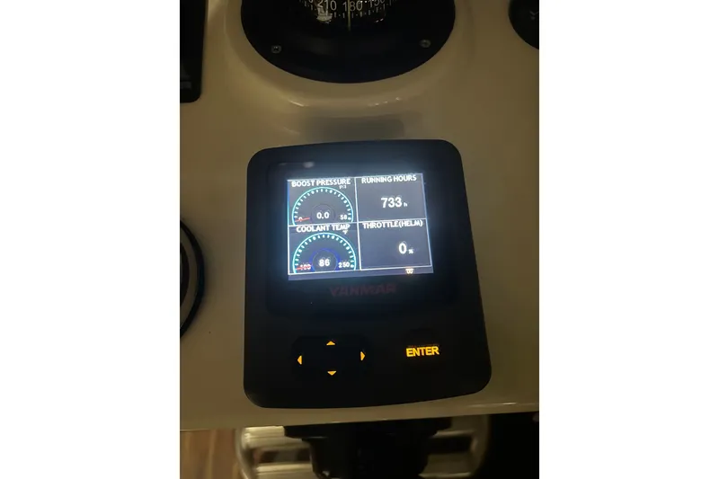 Slide: The Image of Yanmar engine display showing boost pressure, coolant temperature, and running hours on Eastern 35 Casco Bay. - 24